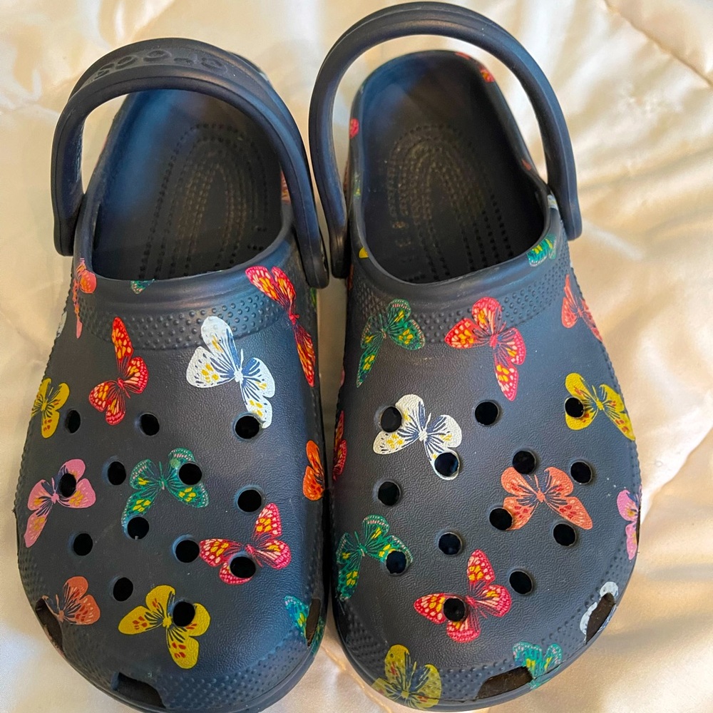 Size 7 navy crocs with butterfly design